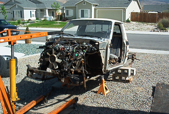truck body on jack stands, engine out, being worked on