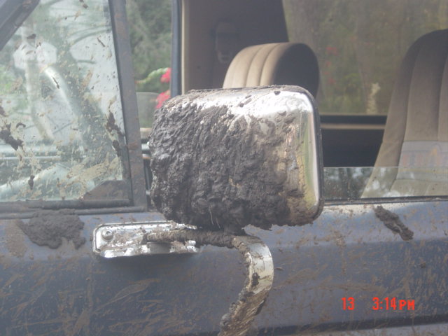 Mud-covered side mirror on 1986 Ford Bronco