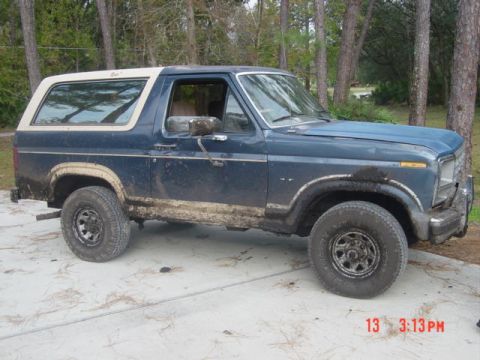 1986 Ford Bronco - This 1986 Ford Bronco is covered in mud, suggesting it has been off-roading.