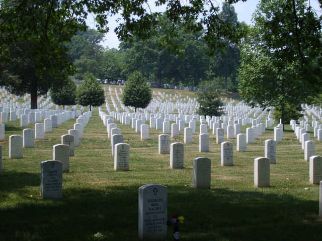 Arlington National Cemetery scene with rows of white headstones