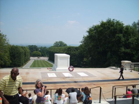 2004 Ford Crown Victoria - A somber scene at the Tomb of the Unknown Soldier, with a guard on duty and visitors observing.