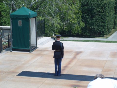 2004 Ford Crown Victoria - A soldier stands guard at the Tomb of the Unknown Soldier, with the iconic guard post visible in the background.