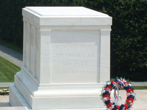 2004 Ford Crown Victoria - The Tomb of the Unknown Soldier at Arlington National Cemetery, with a wreath of red, white, and blue flowers.