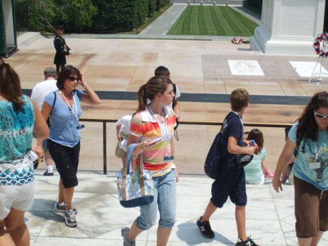 2004 Ford Crown Victoria - Tourists visit a solemn memorial site, with a guard standing watch.
