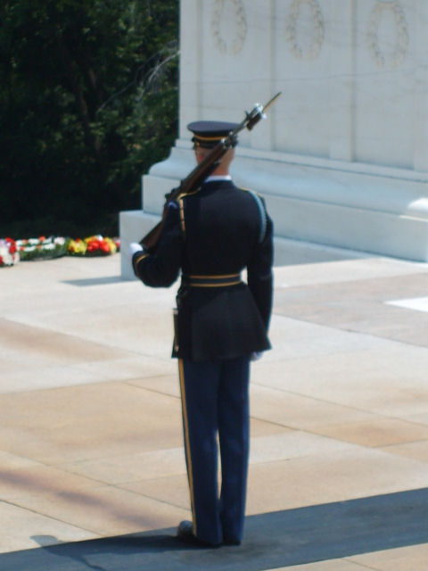 2004 Ford Crown Victoria - A sentinel stands at attention in front of the Tomb of the Unknown Soldier, a solemn monument.