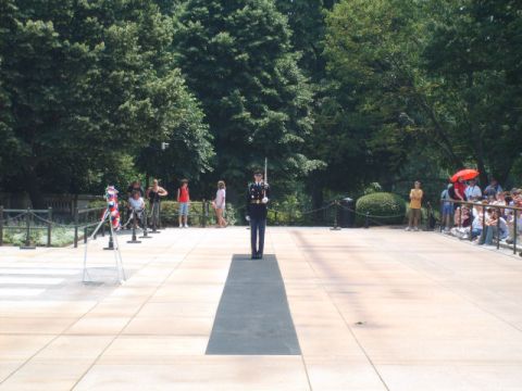 2004 Ford Crown Victoria - A solemn guard stands at attention at the Tomb of the Unknown Soldier, with visitors observing.