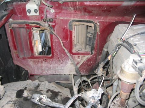 1991 Ford Bronco - The image shows the interior of a vehicle's engine bay, focusing on the firewall and various mechanical components.