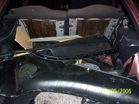1996 Ford Probe - Car interior parts are stored in the cargo area of a vehicle.