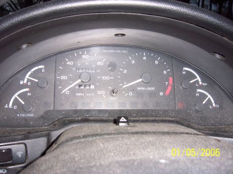 1996 Ford Probe - Interior view of a car's dashboard, the speedometer, tachometer, and fuel and temperature gauges. The odometer shows 160,200 miles.