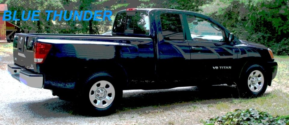 Dark blue 2007 Nissan Titan pickup truck parked outside