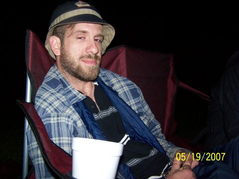1996 Ford Probe - A man wearing a bucket hat and plaid shirt is seated in a camping chair, holding a white cup. The date 05/19/2007 is visible.