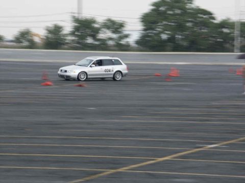 2001 Mercury Grand Marquis - A silver station wagon navigates a course marked by orange cones on a paved track.