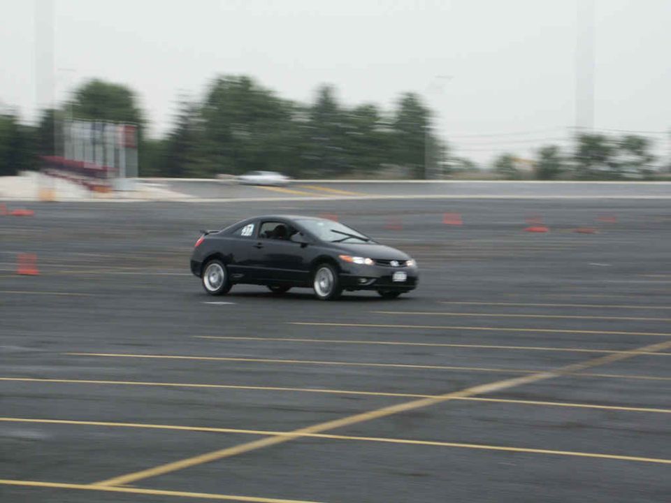 Black sedan with racing number 17 on track