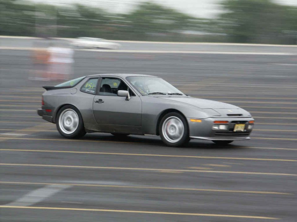 Gray coupe with a spoiler on a track, number 45 visible on door