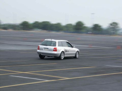 2001 Mercury Grand Marquis - Station wagon navigates a course marked by cones on a hazy day.