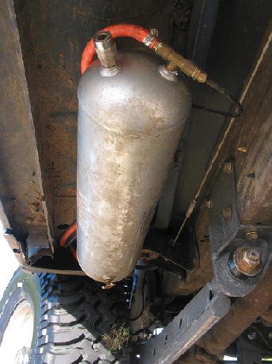 1996 Ford Bronco - Vehicle chassis with an installed air tank and associated plumbing visible.