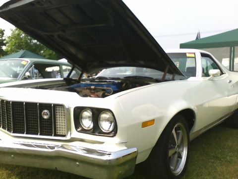 1972 Ford Ranchero - Front view of a white 1972 Ford Ranchero with its hood up, parked outdoors.