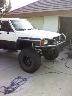 1985 Toyota 4Runner - This modified Toyota 4Runner is equipped for off-road use with a brush guard and large tires.