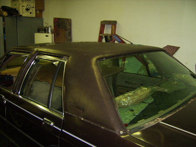 The trim around the doors and windows is removed.  The "LTD Crown Victoria" is also removed.  The "Crown" trim in the center of the roof is removed as well.