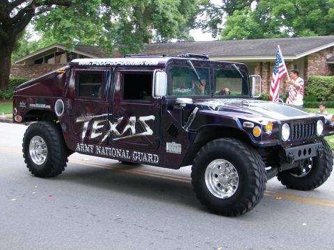 2000 Ford Crown Victoria - Humvee with Texas Army National Guard livery seen during a parade.
