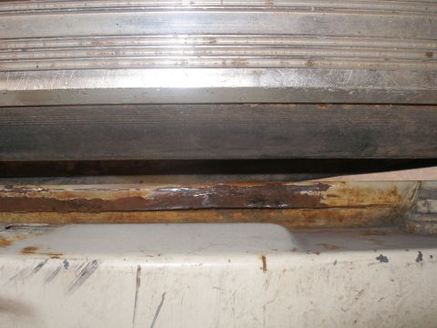 1990 Ford Bronco - Looking between the bed of the truck and the tailgate when folded down. This is the same spot as the hole I cut out. Its like this in about…