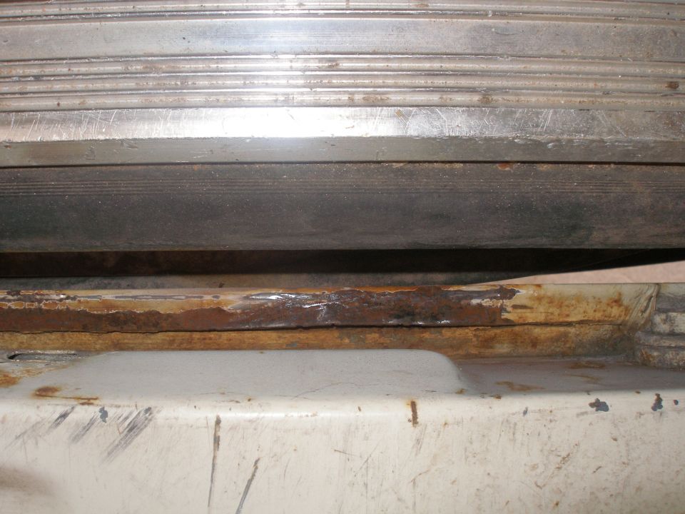 Looking between the bed of the truck and the tailgate when folded down. This is the same spot as the hole I cut out. Its like this in about two other spots on the tailgate.