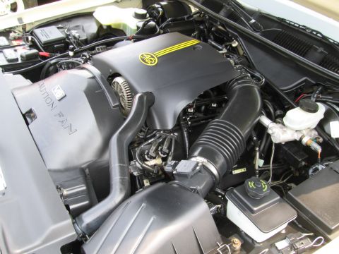 1991 Ford LTD Crown Victoria - The engine bay of a 1991 Ford Crown Victoria LTD is visible, with the 4.6 liter engine cover prominently displayed.