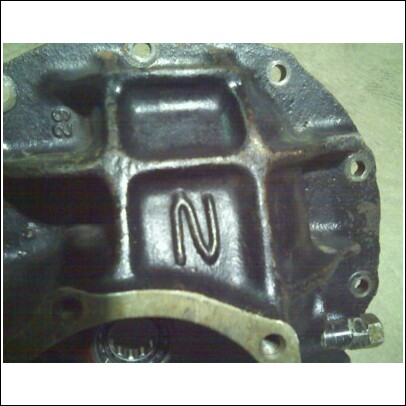 1977 Ford F-150 - Close-up of a cast iron engine component showing the letters N and the number 29 cast into its surface.