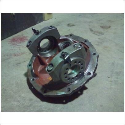 1977 Ford F-150 - Differential carrier assembly, likely from a truck or heavy equipment, shown on a concrete floor.