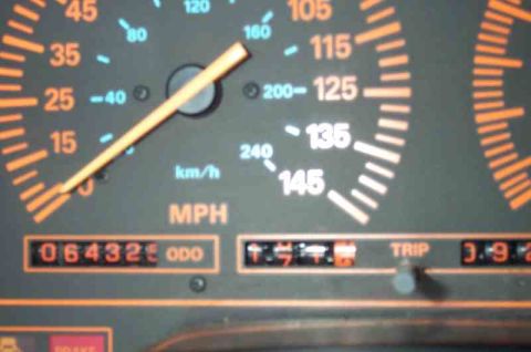 1988 Ford Bronco - Close-up of a vehicle's dashboard gauges, including the speedometer and odometer.