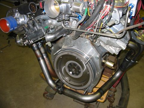 1993 Ford Taurus - Engine assembly with a turbocharger and custom exhaust components is shown.