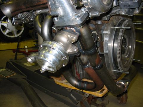 1993 Ford Taurus - Custom turbocharger and exhaust manifold assembly, likely for performance engine modification.
