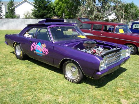 2002 Ford Mustang - Custom purple drag car with hood open, parked on grass next to a red station wagon.