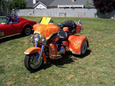 2002 Ford Mustang - Custom trike motorcycle with flame paint job and an American flag on the back.