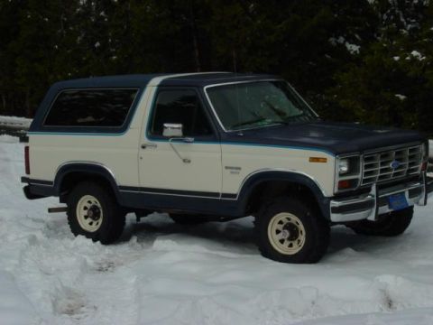 1986 Ford Bronco - This 1986 Ford Bronco is parked in the snow, showing its two-tone paint scheme.