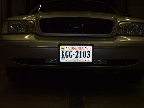 2004 Ford Crown Victoria - The front grille and headlights are consistent with a 2004 Ford Crown Victoria.