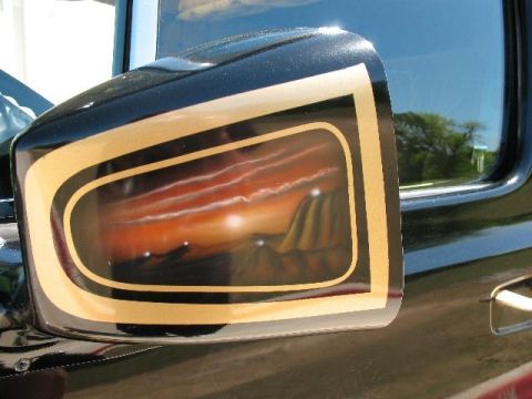 1978 Ford E250 - The side mirror features a custom airbrushed desert sunset scene with mountains and clouds.