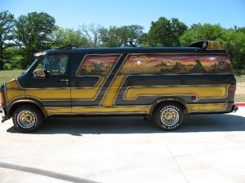 1978 Ford E250 - This custom van features a detailed mural on its side, depicting a sunset over a mountainous landscape with a heart emblem.