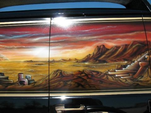 1978 Ford E250 - Van side features custom airbrushed desert landscape art with mountains and a sunset sky.