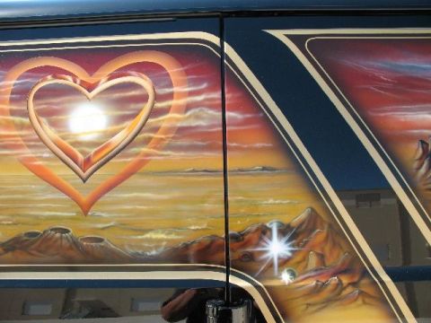 1978 Ford E250 - Custom airbrushed art on a van door shows a sunset scene with mountains and a double heart graphic.