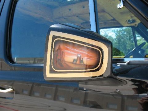 1978 Ford E250 - Custom airbrushed side mirror on a 1978 Ford E250 depicts a desert sunset scene.