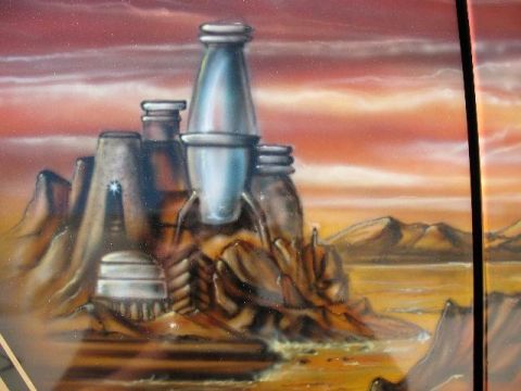 1978 Ford E250 - This airbrushed mural depicts a science fiction landscape with towering structures and a dramatic sky.