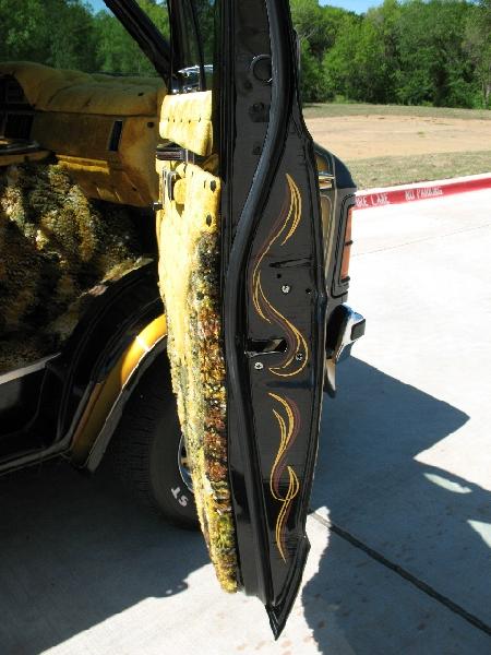 1978 Ford E250 - Custom van interior with shag carpet and flame decals on the door jamb.
