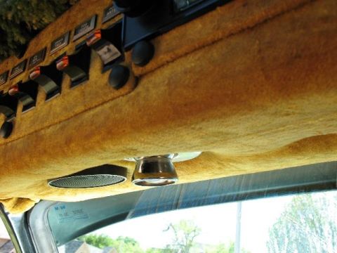 1978 Ford E250 - Interior view of a van's dashboard and headliner, showing various switches and a speaker.