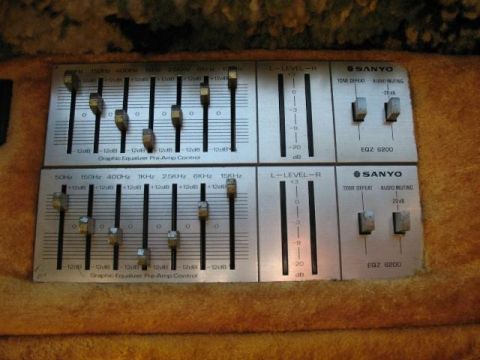 1978 Ford E250 - Close-up of two Sanyo EQZ 6200 graphic equalizers, each with multiple sliders and toggle switches.