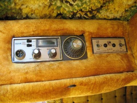 1978 Ford E250 - Close-up of the interior showing a CB radio and various toggle switches and knobs.