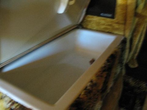 1978 Ford E250 - Interior view of an open storage compartment, possibly in a vehicle or RV.