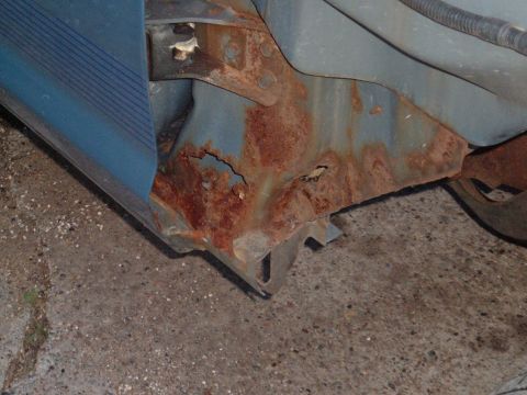 1990 Ford Ranger - Severe rust damage is visible on the vehicle's frame and structural components.