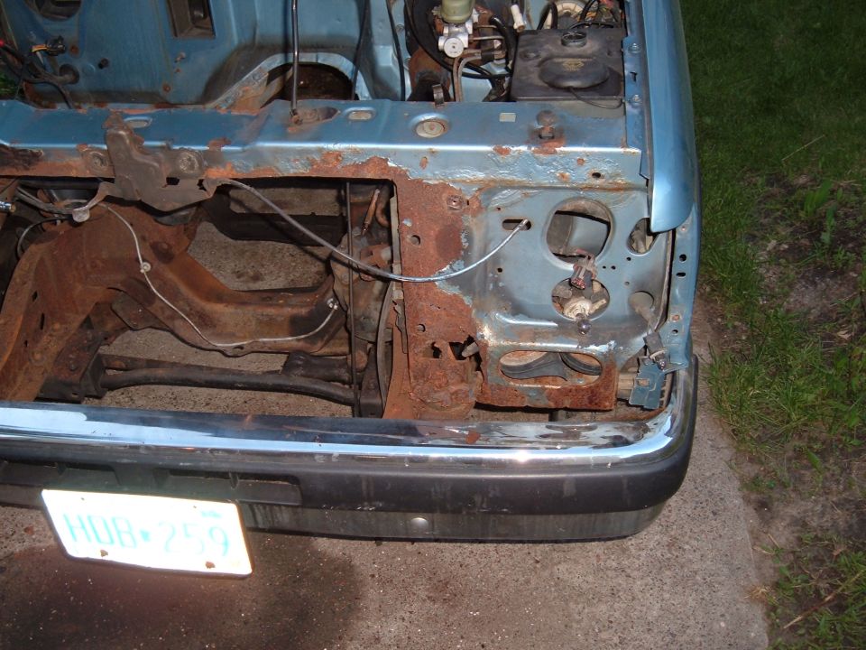 1990 Ford Ranger front end with heavy rust and missing headlight assembly