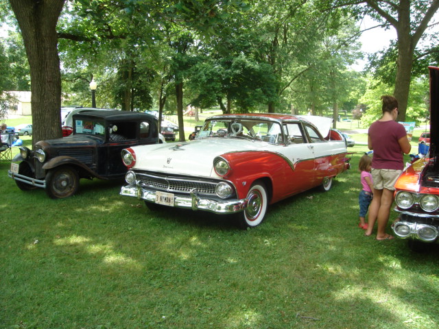 Red and white 1955 Ford Fairlane Crown Victoria, 3q-front view